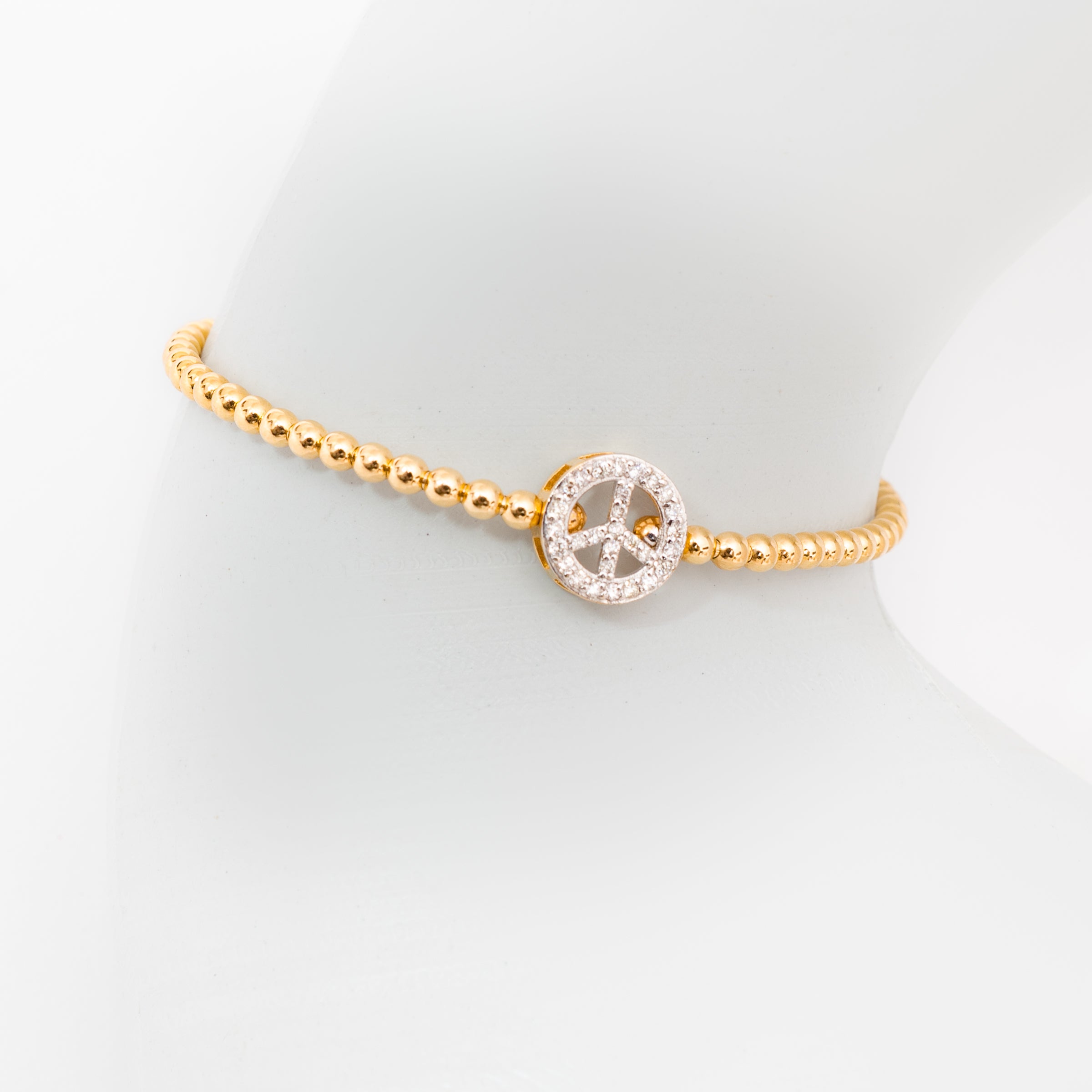 Pulseira maleável bolinhas ouro 18k com símbolo da paz em diamante