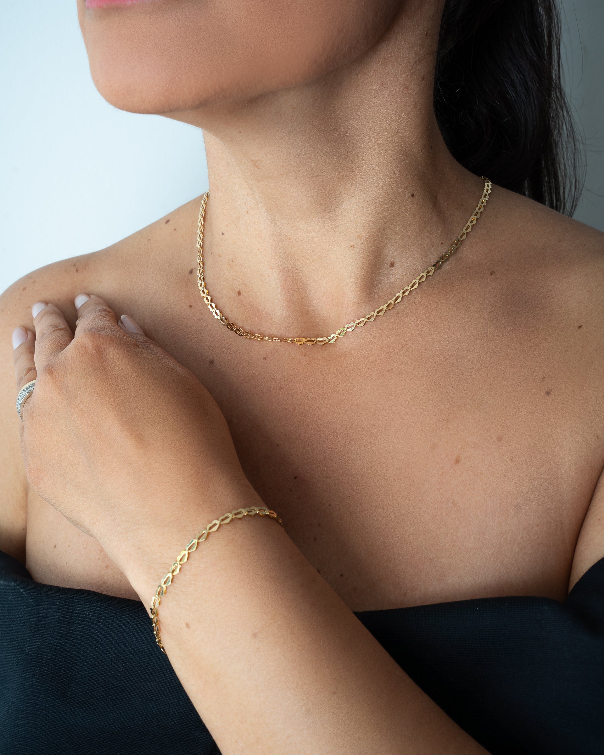 Pulseira Love corações unidos ouro 18k