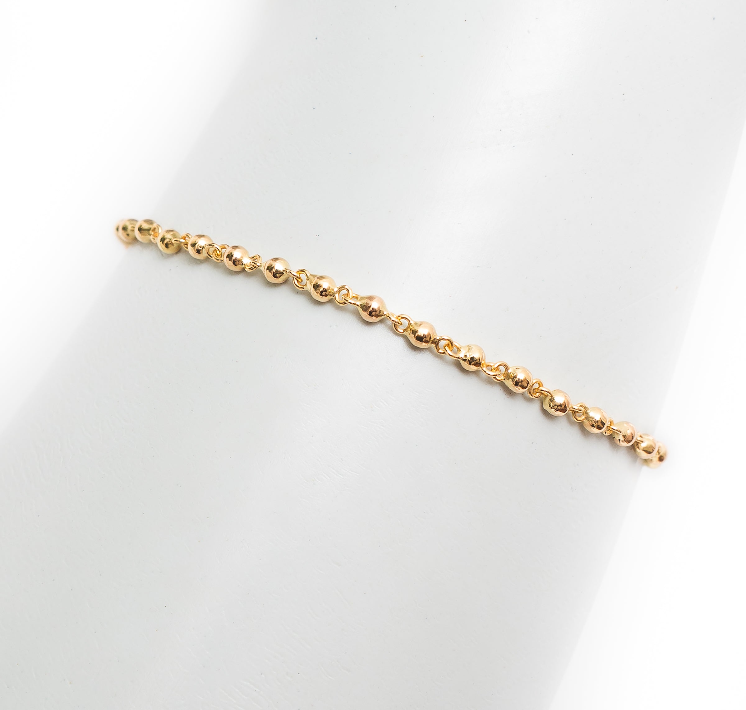 Pulseira bolinhas polidas ouro 18k
